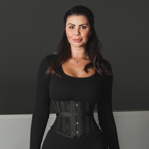 Female patient showing results of body contouring surgery in Marbella, Spain.